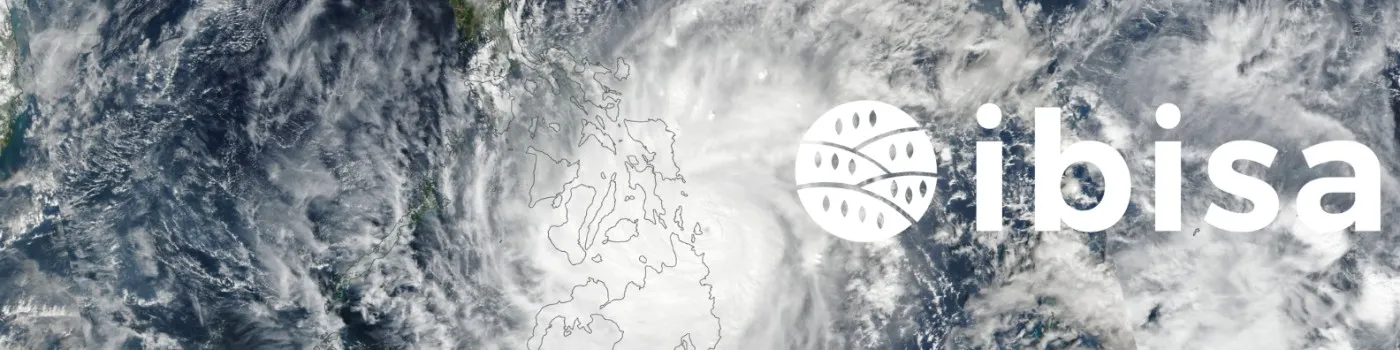 IBISA banner featuring a satellite image of a typhoon over the Philippines, with white swirling clouds covering the region. The IBISA logo, consisting of a circular emblem with curved lines and small dots resembling agricultural fields or satellite data, is displayed in white alongside the bold lowercase text 'ibisa'