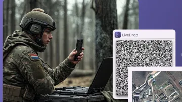 A picture of a soldier scannen a LiveDrop code in the field